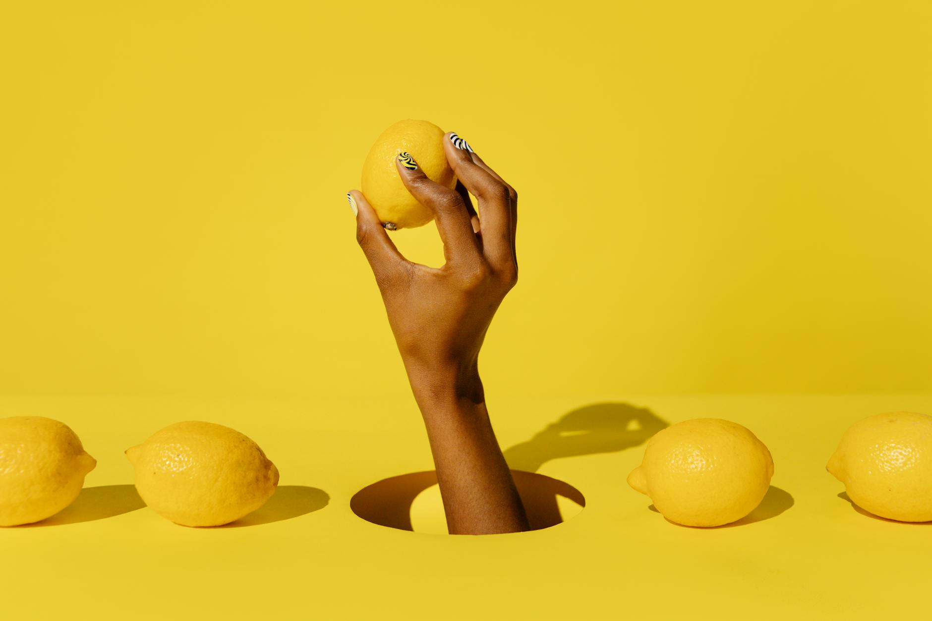 A yellow silicone clitoral vibrator surrounded by peeled bananas on a bright yellow background, symbolizing renewal and self-care after parenthood