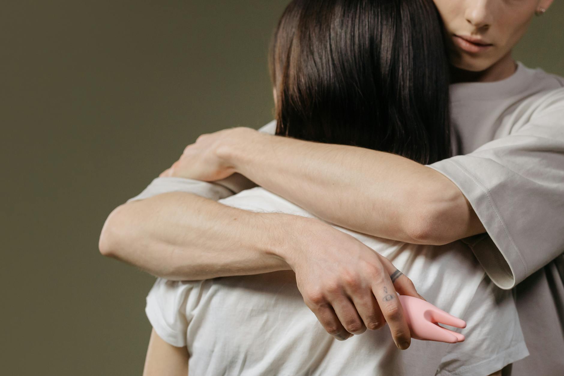 Couple embracing in intimate moment, showing emotional connection and vulnerability